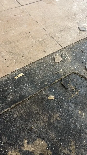 Black bitumen mastic floor removal in a SE10 flat